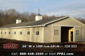 Full exterior of 003 36x108x10 equestrian post frame building with ash gray siding, charcoal shingle roof, and two cupolas