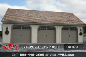24x40 garage exterior with brown gutters and stained board and batten trim