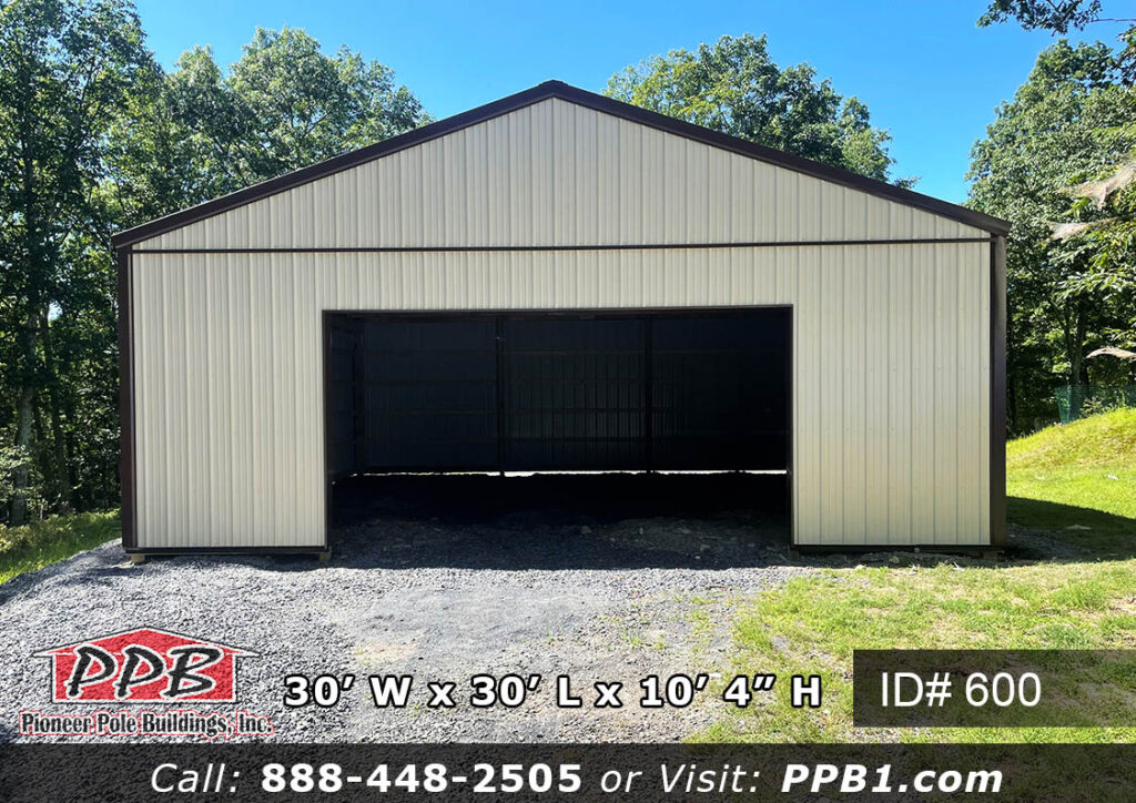 600 (30’Wx30’Lx10’H) 3 Garage exterior with insulated garage door open showing interior depth
