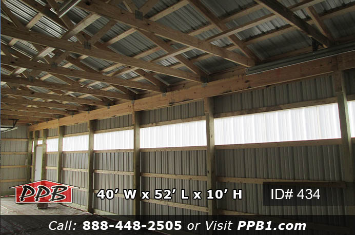 Inside a agricultural building with sidelights.
