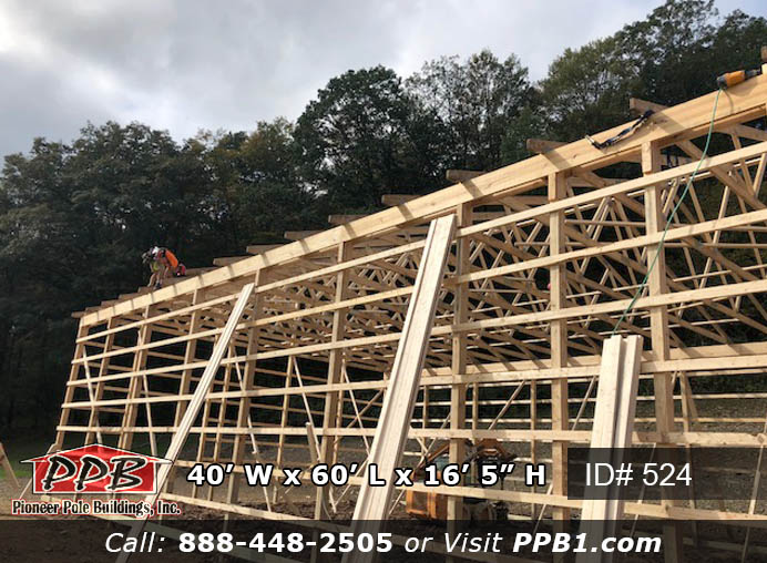 Pole Building Dimensions: 40’ W x 60’ L x 16’ 5” H (ID# 524) Two-Tone Equipment Stoage Barn 40’ Standard Trusses, 4’ on Center 4/12 Pitch Colors: Two-Tone Siding Color: Upper Color: Red Lower Color: Black Roofing Color: Black Trim Color: Black Openings: (1) 14’ x 14’ Split-Slider Doors, Color: Red, with White Frame (1) 8’ x 8’ Slider Door, Color: Red, with White Frame (1) 3068 9-Lite Insulated Fiberglass Entry Door (5) 3’ x 4’ Single-Hung Windows with Grids, Color: White 