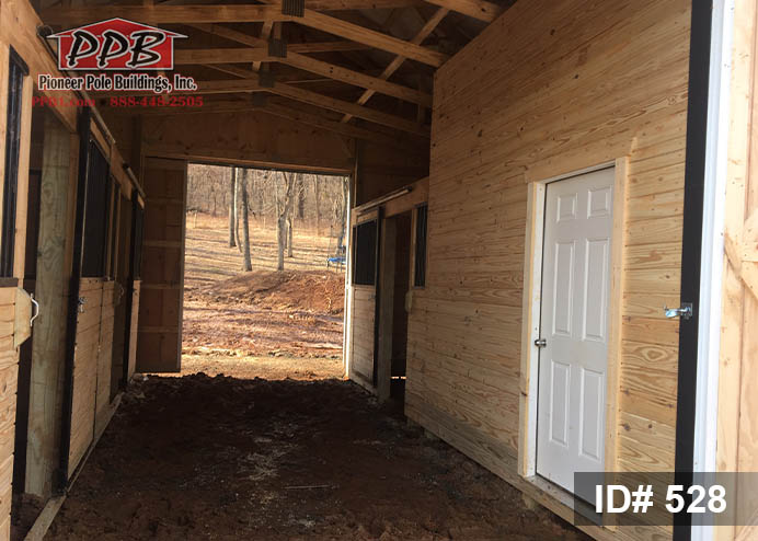Board and Batten Barn Dimensions: 30’ W x 24’ L x 10’4” H (ID# 528) 30’ Standard Trusses, 4’ on Center, 4/12 Pitch Colors: Siding Color: Board&Batten Natural Roofing: Black Trim Color: Black Openings: (2) 10’ x 9’ Split-Sliding Door, Non-Insulated with White Frame (1) 3068 6-panel Entry Door (3) Pine Dutch Doors 4’ x 7’ Outswing