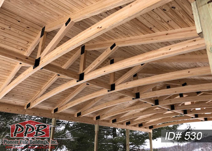 Pole Building Dimensions: 24’ W x 40’ L x 10’ 4” H (ID# 530) 24’ Custom Arched Glulam Trusses, 4’ on Center, 4/12 Pitch Colors: Roofing: Architectural Shingles, Pewter Gray Overhangs: Eaves & Gables: 1’ Gutter: 5K, Color: Brown 