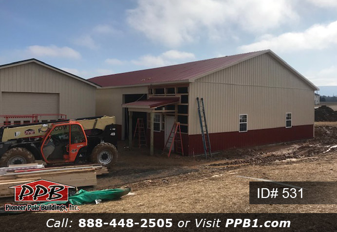 Pole Building Dimensions: 50’ W x 100’ L x 14’ 6” H (ID# 531) 50’ Standard Trusses, 4’ on Center 4/12 Pitch Colors: Two-Tone Siding Color: Upper Color: Beige Lower Color: Red Roofing Color: Red Trim Color: Red