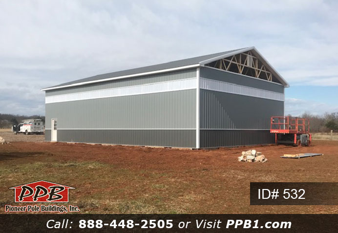 Pole Building Dimensions: 40’ W x 60’ L x 16’ 4” H (ID# 532) 40’ Standard Trusses, 4’ on Center 4/12 Pitch Colors: Two-Tone Siding Color: Upper Color: Slate Lower Color: Charcoal Roofing Color: Charcoal Trim Color: Brite White