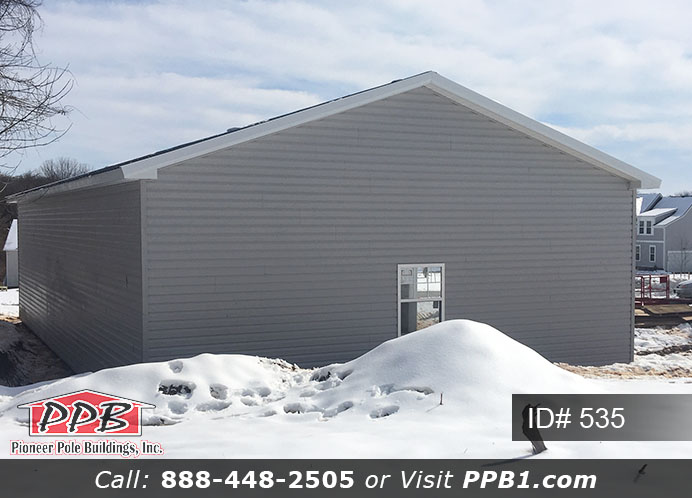 Pole Building Dimensions: 30’ W x 56’ L x 12’ 4” H (ID# 535) 30’ Standard Trusses, 4’ on Center 4/12 Pitch Colors: Siding Color: Sterling Gray (Vinyl Siding) Roofing Color: Black Trim Color: White & Black Openings: (3) 10’ x 8’ Residential Classic Garage Doors with (5) Windows & Hi-Lift (1) 3068 6-Panel Insulated Entry Door (3) 3’ x 4’ Single-Hung Insulated Windows with Screens & Grids