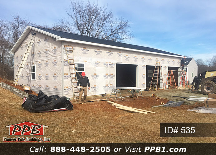 Pole Building Dimensions: 30’ W x 56’ L x 12’ 4” H (ID# 535) 30’ Standard Trusses, 4’ on Center 4/12 Pitch Colors: Siding Color: Sterling Gray (Vinyl Siding) Roofing Color: Black Trim Color: White & Black Openings: (3) 10’ x 8’ Residential Classic Garage Doors with (5) Windows & Hi-Lift (1) 3068 6-Panel Insulated Entry Door (3) 3’ x 4’ Single-Hung Insulated Windows with Screens & Grids