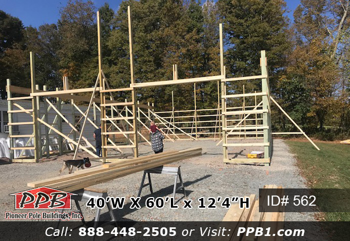 Pole Building Dimensions: 40’ W x 60’ L x 12’ 4” H (ID# 562) A Two-Tone Insulated Shop with Lots of Storage Space 40’ Standard Trusses, 4’ on Center 4/12 Pitch Colors: Two-Tone Siding Color: Upper Color: Ash Gray Lower Color: Charcoal Roofing Color: Charcoal Trim Color: Brite White