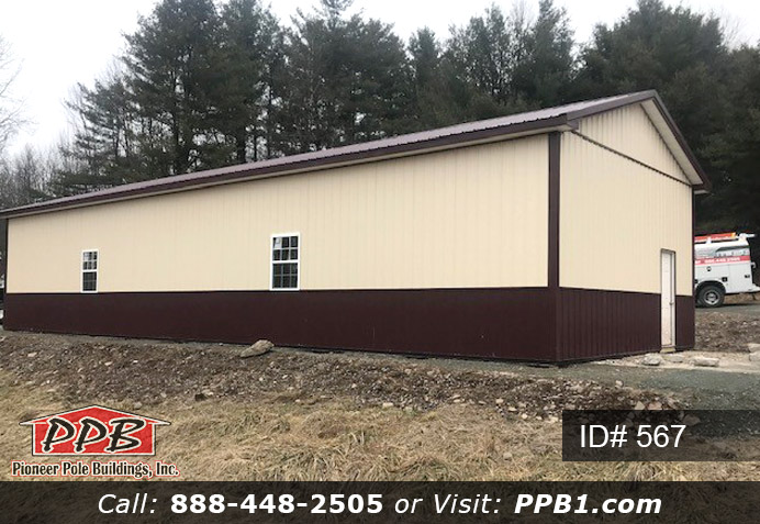 Beige and burgundy two-tone siding pole building.