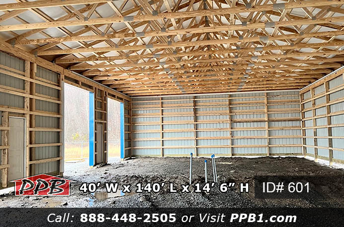 Long Commercial Storage Pole Building Dimensions • 40’ W x 140’ L x 14’ 6” H (ID# 601) • 40’ Standard Trusses, 4’ on Center • 4/12 Pitch Long Commercial Storage Pole Building Colors • Siding Color: Light Stone • Roofing Color: Heron Blue • Trim Color: Heron Blue Long Commercial Storage Pole Building Openings • (4) 10’ x 12’ Commercial Micro Grooved Insulated Garage Doors • (2) 3068 6-Panel Fiberglass Insulated Entry Door • (1) Ceiling Liner Insulated Access Door, Color: White • (1) 40' Gable Open