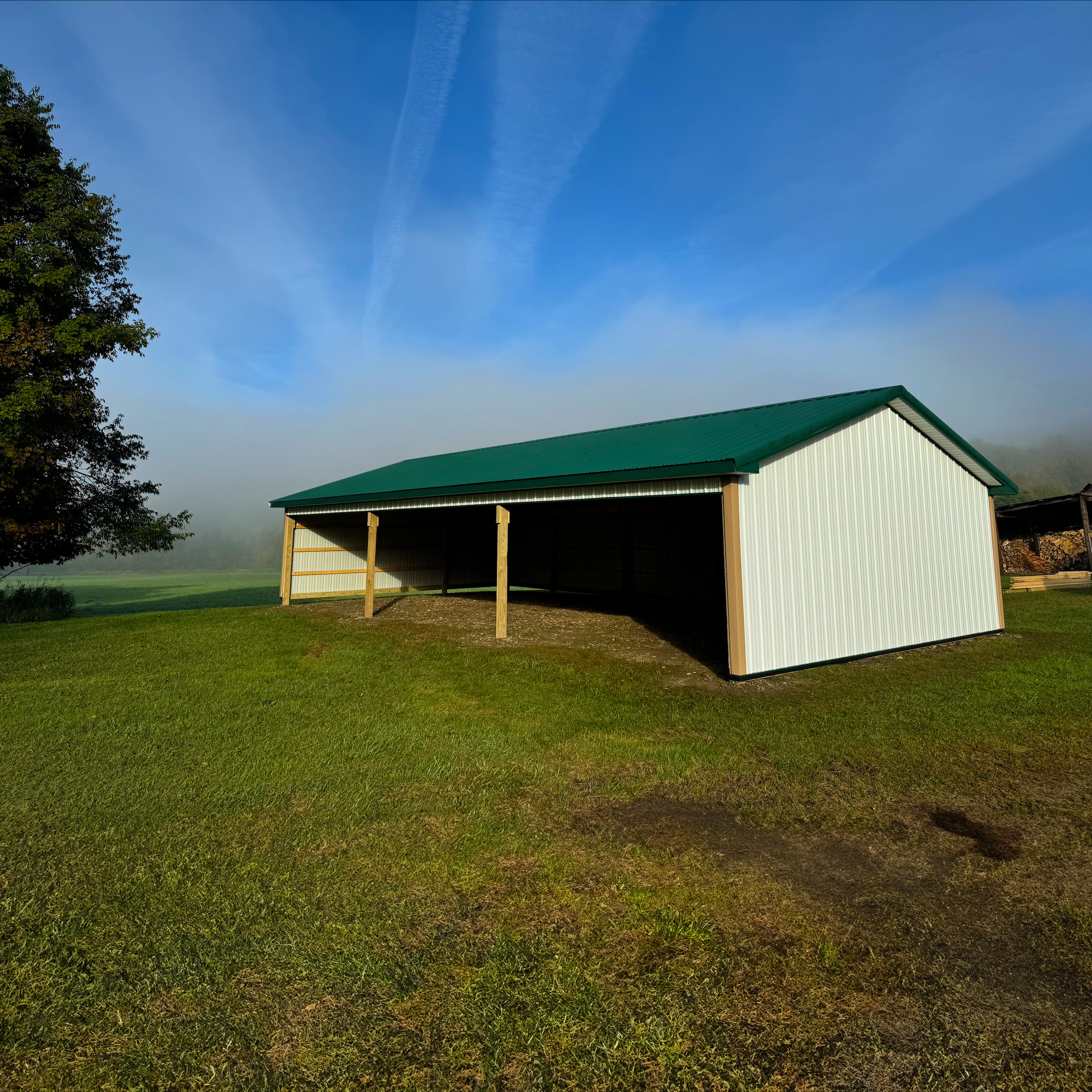 Open-Side Agricultural Building for Farm Storage Three-sided equipment shelter built by post-frame construction company in Pennsylvania