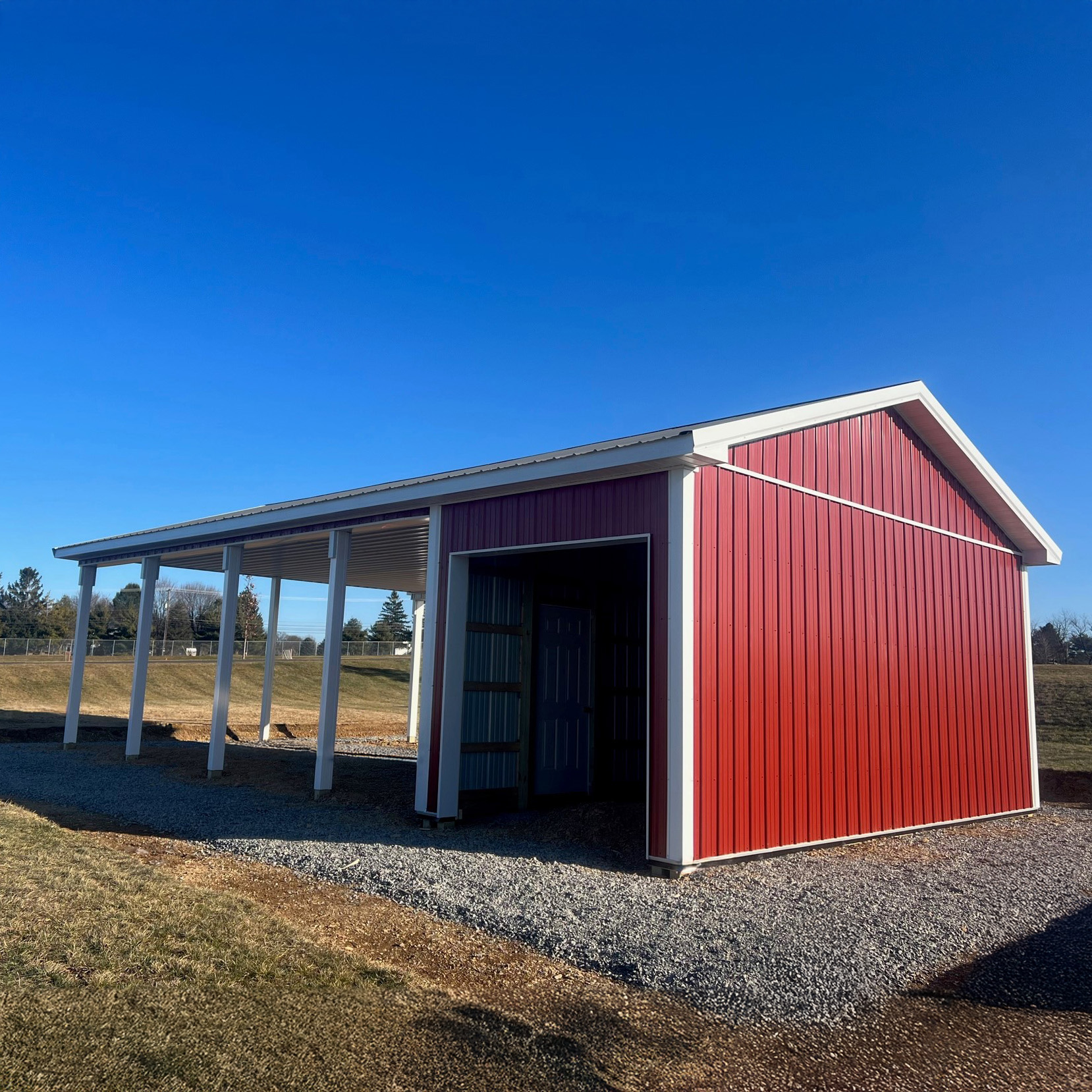 Red Pavilion with Extra Storage in Rural Pennsylvania Pavilion with attached storage built by a local pole barn contractor in Pennsylvania
