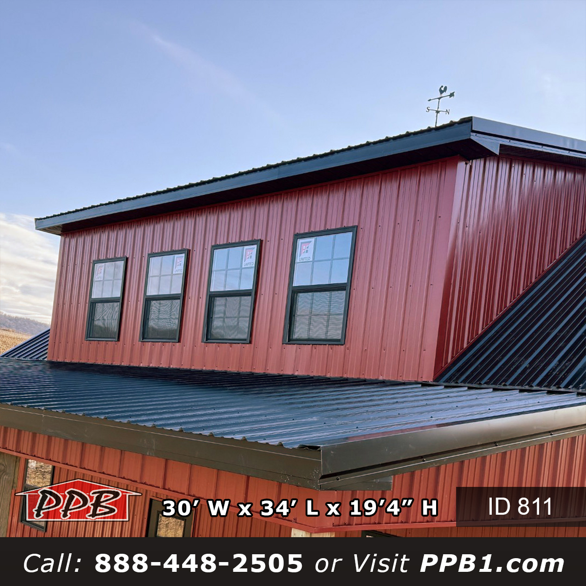 Two story garage build with dormer on red metal garage