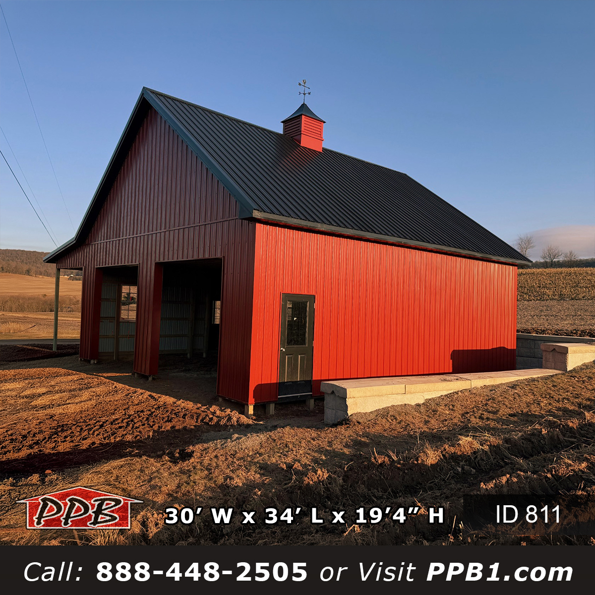 red metal garage with cupola and black roof