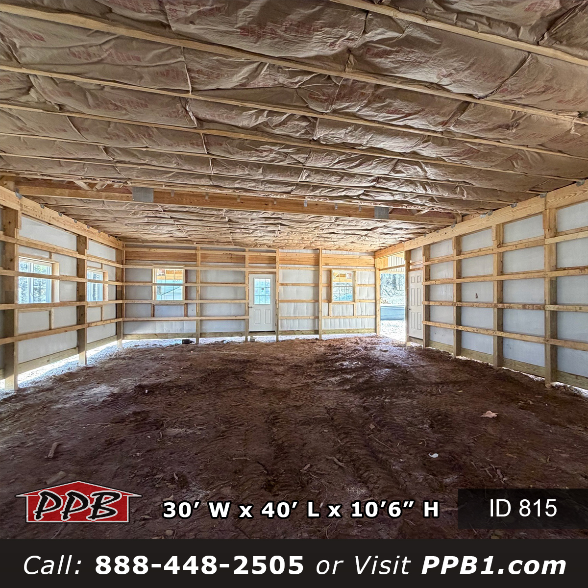 Insulated hobby workshop main floor showing R-21 wall batts and ceiling vapor barrier