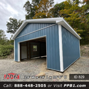 Garage with wide door and white entry door at the front corner of a blue steel building from NJ garage builders